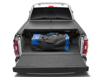 Load image into Gallery viewer, Roll-N-Lock 21-22 Ford F-150 (67.1in. Bed Length) Cargo Manager